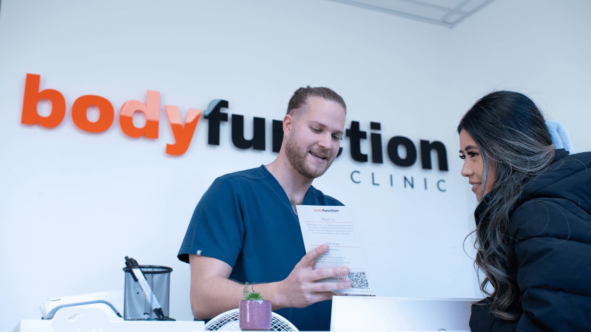 Bodyfunction Clinic Islington reception discussion with patient