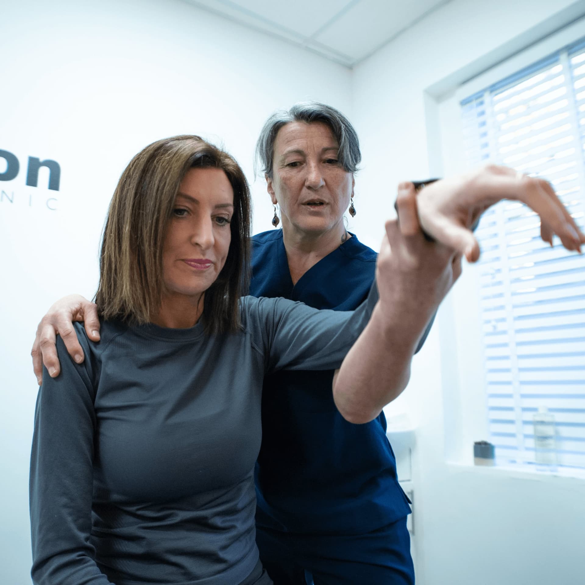 Elbow pain movement assessment at Bodyfunction Clinic