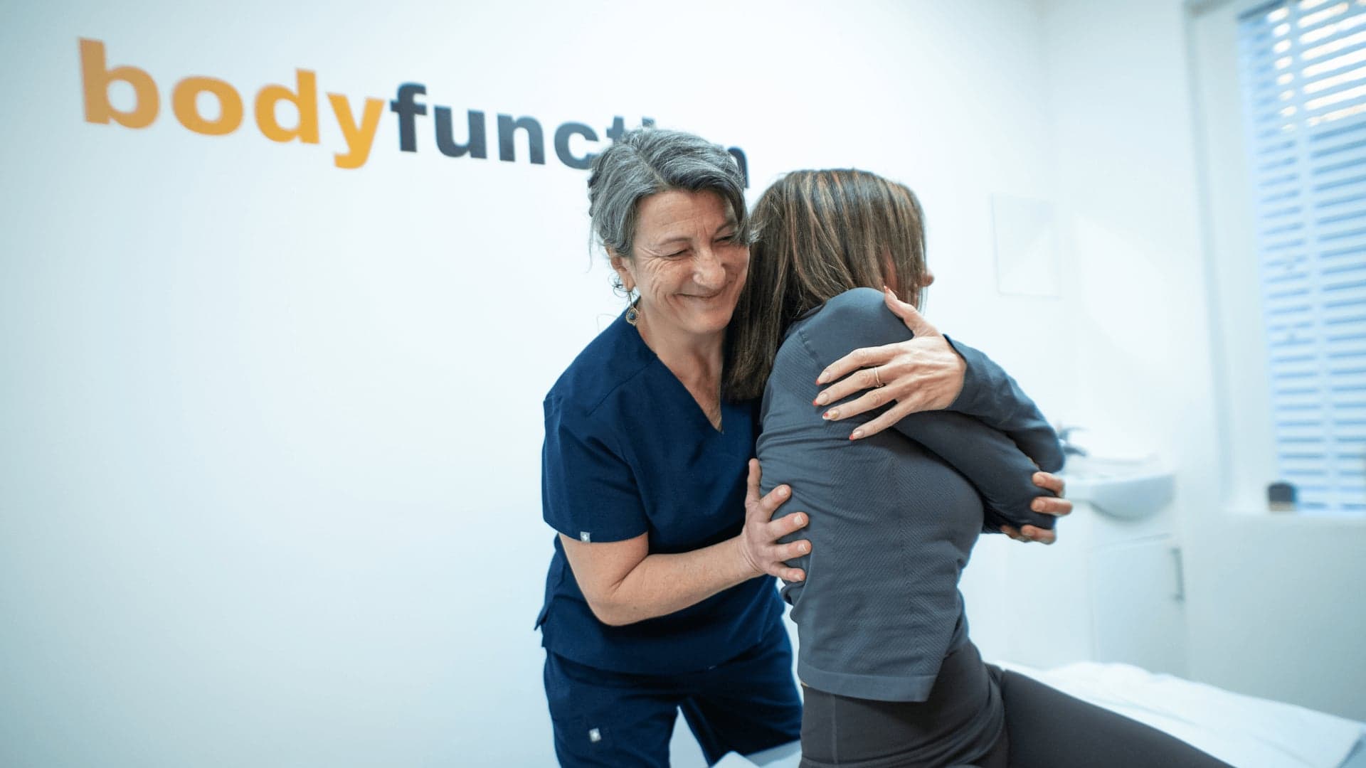 Osteopath performing postural check for back pain treatment at Bodyfunction Clinic