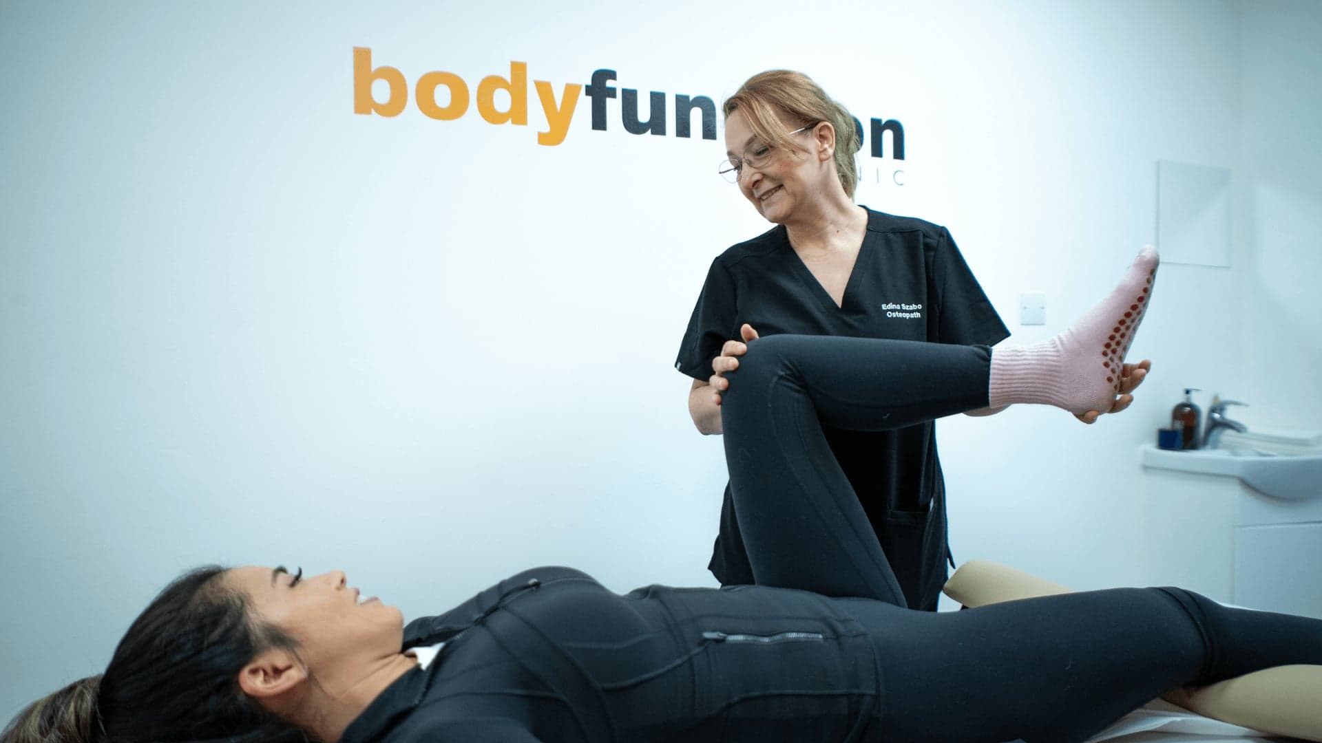Patient receiving osteopathy leg stretch treatment at an osteopathy and physiotherapy clinic