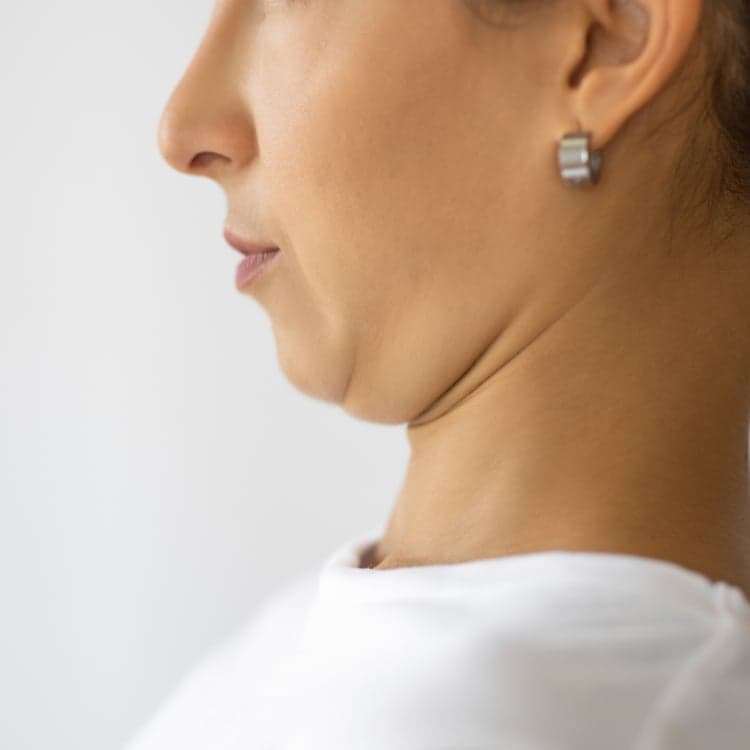Chin tuck exercise for neck pain treatment and posture correction