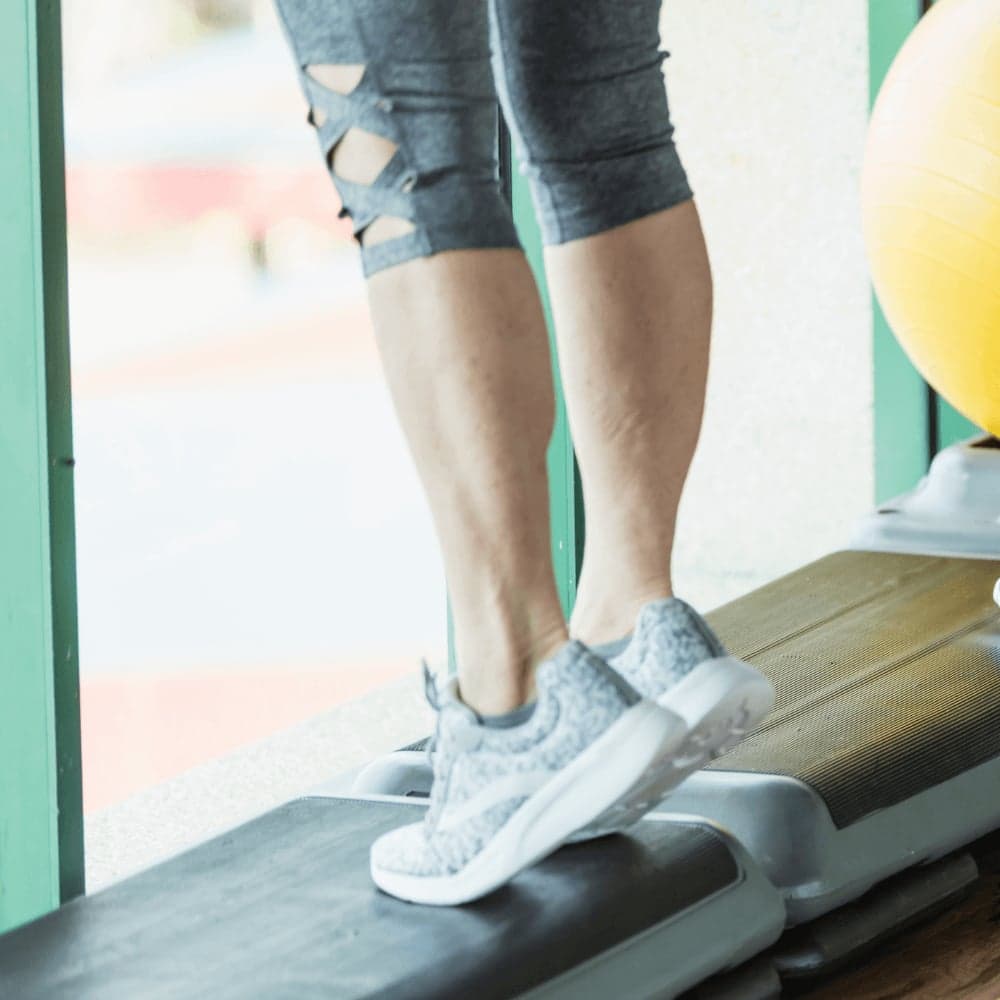 Calf raise exercise for knee pain treatment and lower leg strengthening