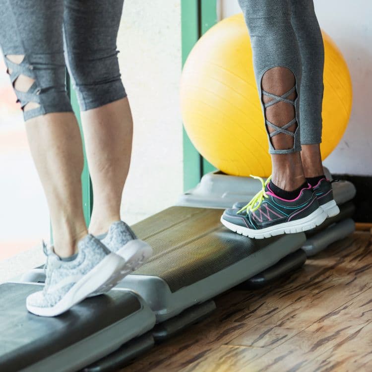 Heel raises performed on a step
